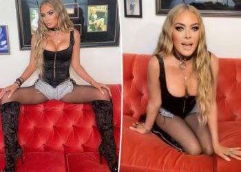 Carmen Electra, 53, rocks corset top and fishnet stockings in racy at-home photo shoot